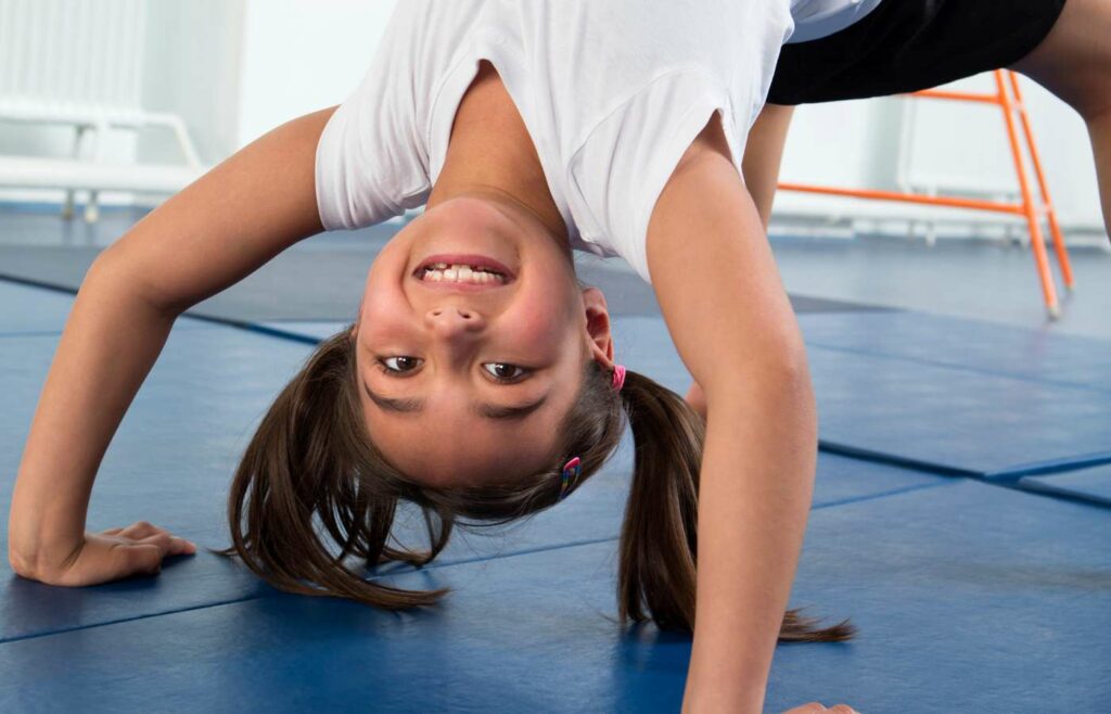 Girl doing a backbend at a gymnastics club
