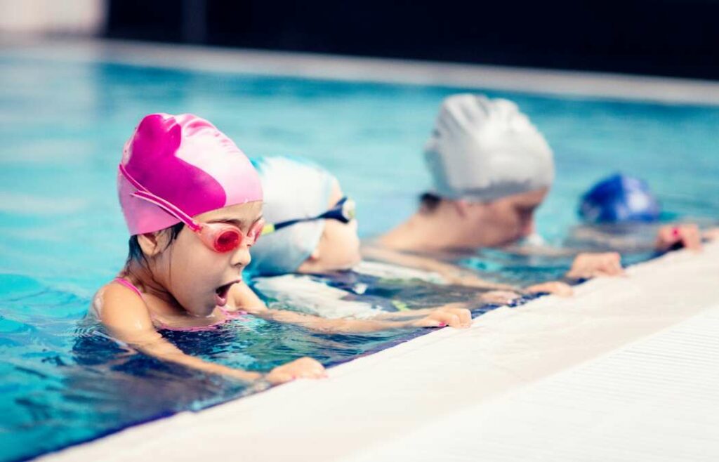 Kids in a swim lesson